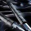 A close-up shot of two swords with black handles resting on a dark, silky fabric. Podgląd zdjęcia produktu