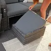 A person's hands are shown adjusting a cushion on an outdoor furniture set. Produktbild-Vorschau