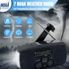 A black NOAA weather radio with an extended antenna is shown in the foreground, with a dramatic background of a tornado and lightning. Produktbild-Vorschau