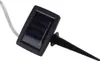 A close-up of a solar panel with a stake attached, likely for outdoor lighting. Produktbild-Vorschau
