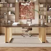 A modern office setting with a large wooden desk, a leather office chair, and bookshelves filled with books and decor. Anteprima dell’immagine prodotto