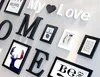 A wall decorated with letters and picture frames. Produktbild-Vorschau