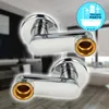 Two chrome-plated S-shaped connectors with brass fittings, set against a blurred bathroom background. A circular logo with icons and text is in the upper right corner. Produktbild-Vorschau