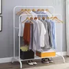 A double-tiered clothing rack with clothes hanging on it, and some items on the bottom shelf. Podgląd zdjęcia produktu