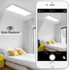 A bedroom with a modern LED panel ceiling light, shown both in the room and on a smartphone screen. Anteprima dell’immagine prodotto