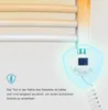 Close-up of a white electric towel radiator with a digital display showing '30' and a blue glowing protective shield around the control unit. Podgląd zdjęcia produktu