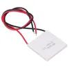 A square thermoelectric generator module with red and black wires attached. Podgląd zdjęcia produktu