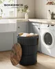 A laundry room scene with a washing machine, sink, and a SONGMICS laundry basket. Produktbild-Vorschau