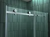 A close-up view of a shower door's sliding mechanism against a tiled wall. Produktbild-Vorschau