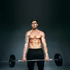 A muscular man holding a barbell. Náhľad obrázku produktu