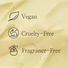 Three icons with text indicating product features: Vegan, Cruelty-Free, and Fragrance-Free, set against a creamy, textured background. Voir les images du produit