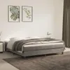 A bedroom scene with a bed, nightstand, and artwork on the wall. Voir les images du produit