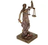 A statue of the Roman goddess of justice, Justitia, holding scales and a sword. Produktbild-Vorschau