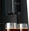 Close-up of a coffee machine dispensing coffee into two glasses. Produktbild-Vorschau