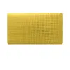 A yellow pillow with a perforated surface is shown against a white background. Produktbild-Vorschau
