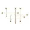 A gold metal wall hook with a geometric, abstract design, featuring multiple horizontal and vertical bars with spherical ends. Voir les images du produit