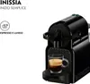A black Nespresso coffee machine with a cup of espresso. Produktbild-Vorschau