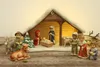 A nativity scene with figurines inside a stable. Produktbild-Vorschau