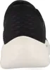 The back view of a black slip-on shoe with a white sole. Náhľad obrázku produktu