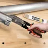 A hand is using a pair of multi-tool pliers to cut a metal pipe. A folding ruler is visible in the background. Anteprima dell’immagine prodotto