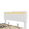 A close-up view of a white upholstered headboard with diamond tufting and a yellow LED light strip. Náhled obrázku produktu