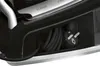 A close-up view of the power cord and plug storage area of an appliance. Produktbild-Vorschau