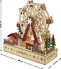 A wooden Ferris wheel model with small figures and trees on a base, with dimensions indicated. Náhled obrázku produktu