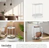 A collage of four images showcasing a white side table in different room settings, including a dining room, a reading nook, and a living room, along with a product shot. Náhled obrázku produktu