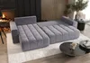 A modern living room with a gray sectional sofa, fireplace, and coffee tables. Náhled obrázku produktu