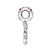 A close-up side view of a silver charm with pink and purple stones. Produktbild-Vorschau