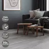A living room scene with a sofa, coffee tables, and flooring. Podgląd zdjęcia produktu