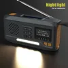 A digital radio with a built-in flashlight is shown on a dark surface, with a bright light emanating from the flashlight. Produktbild-Vorschau