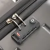 A close-up shot of a suitcase lock and zipper. Náhľad obrázku produktu