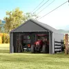 A gray carport tent with a red tractor inside, parked on a grassy lawn. Produktbild-Vorschau