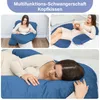 Collage of images showing a woman using a blue U-shaped pregnancy pillow in different positions: sitting and reading, lying down on a bed, and sleeping on her side. Náhľad obrázku produktu