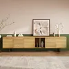A modern living room with a wooden TV stand, artwork, and decorative items. Voir les images du produit