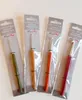 Four crochet hooks in their original packaging, arranged diagonally. Produktbild-Vorschau