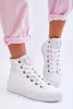 A person wearing white high-top sneakers and pink pants. Produktbild-Vorschau