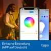 People at a party, with a smartphone displaying a smart lamp app. Produktbild-Vorschau