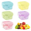A collage of colorful food storage containers and a pile of fresh fruit. Produktbild-Vorschau