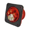 A close-up, angled view of a red and gray electrical connector with gold contacts, set against a white background. Produktbild-Vorschau