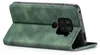 A green flip case for a smartphone is shown from the side, with the phone inserted and the cover open. Produktbild-Vorschau