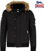 A black hooded winter jacket with fur trim on the hood, displayed against a white background. The Lonsdale logo is visible in the top right corner. Náhled obrázku produktu