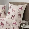 A close-up view of a bed with pillows and a duvet cover featuring a deer pattern. Produktbild-Vorschau