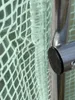 A close-up view of a greenhouse frame and plastic sheeting. Produktbild-Vorschau