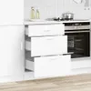 A white kitchen cabinet with drawers and an oven. The drawers are partially open. Voir les images du produit