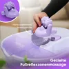 A hand is shown placing a removable massage roller into a purple and white foot bath filled with bubbly water. Náhľad obrázku produktu