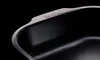 A close-up shot of the edge of a dark roasting pan with the brand name 'WOLL' embossed on it. Produktbild-Vorschau