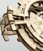A close-up view of a wooden 3D puzzle, specifically a perpetual calendar, showing intricate details of its gears and engraved numbers and text. Anteprima dell’immagine prodotto