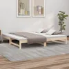 A wooden daybed with a mattress and pillows is shown in a room with artwork on the wall and a plant. Produktbild-Vorschau